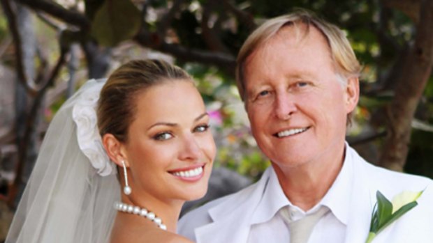 Beauty and the geek ... Kristy Hinze and Jim Clark on their wedding day.