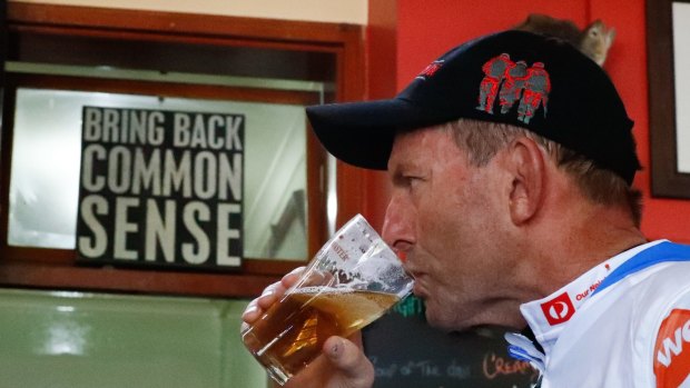 Tony Abbott has a beer at the Snow Goose Motel in Adaminaby.