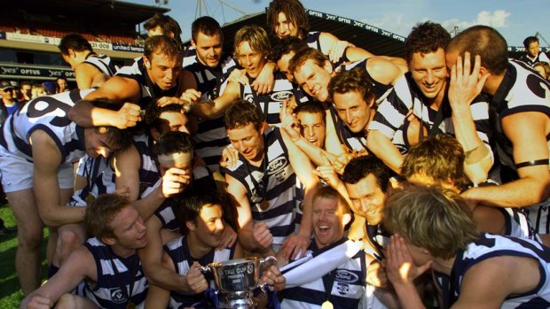 Dynasty created: Geelong celebrate their win over Port Melbourne in the 2002 VFL grand final. Cats players took pay cuts to keep their great team together.