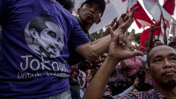 Jokowi supporters celebrate.