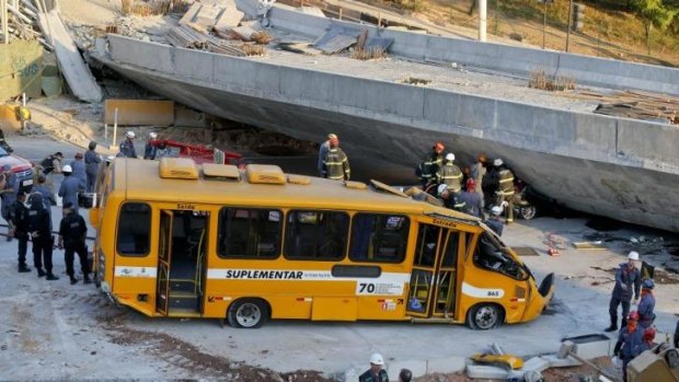 A bus sits damaged after a bridge collapsed in Belo Horizonte, Brazil.
