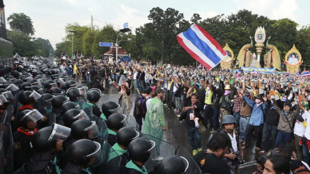 Confrontation: Riot policemen and anti-government protesters during a rally in Bangkok.