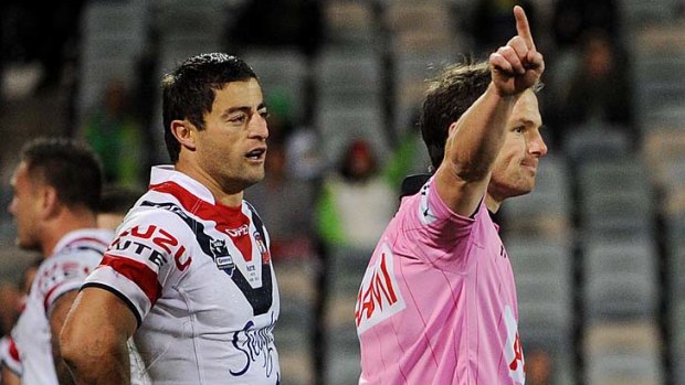 You're off! ... Roosters veteran Anthony Minichiello is given his marching orders by referee Alan Shortall after a high shot on Raiders fullback Josh Dugan at Canberra Stadium last night.