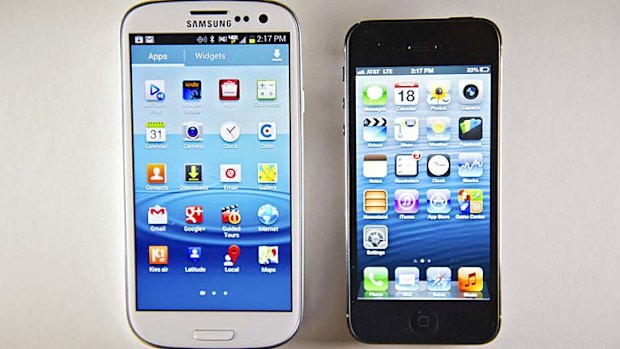 Apple's iPhone 5, right, has a 4-inch screen, while Samsung's Galaxy S 3 has a 4.8-inch screen.