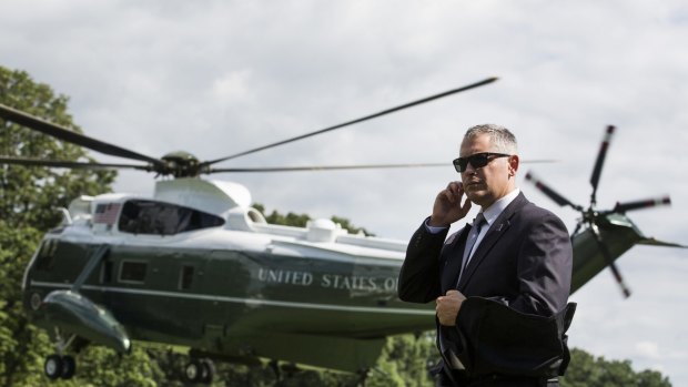 US Secret Service Agent stands as Marine One, with U.S. President Donald Trump and First Lady Melania Trump on board. 