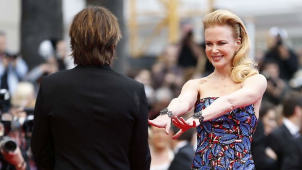Reunited: Nicole Kidman and her husband Keith Urban play up to the cameras.