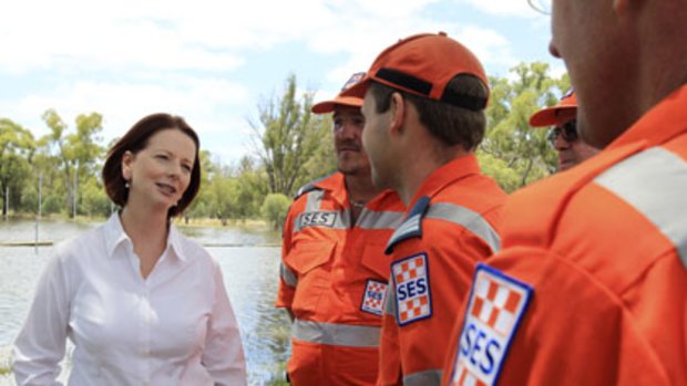 Julia Gillard ... considering a levy to fund rebuilding from the floods.