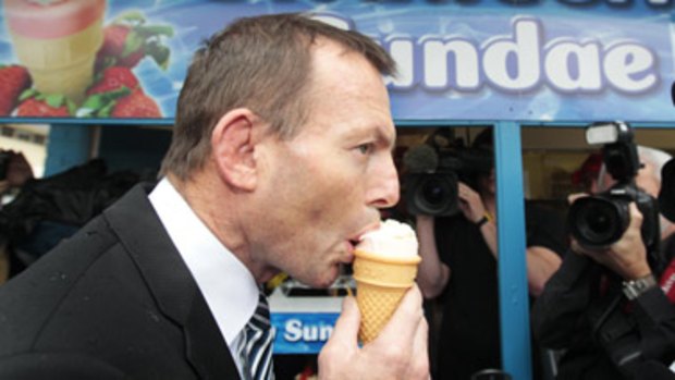 Traditional tastes: Tony Abbott, on the campaign trail in Brisbane, dives into a strawberry sundae, generally accepted as haute cuisine at the Ekka.