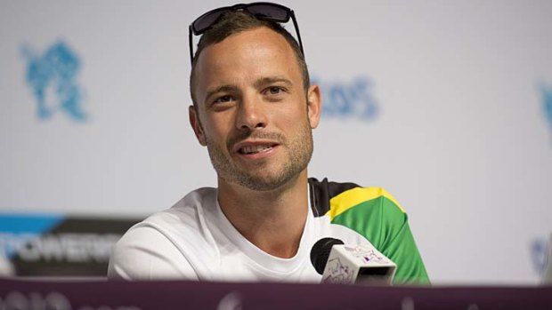 South Africa's double-amputee runner Oscar Pistorius talks to the media at a press conference yesterday.