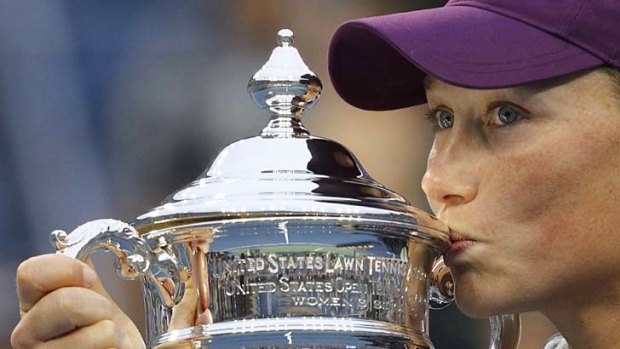 Samantha Stosur kisses her trophy after winning the US Open.