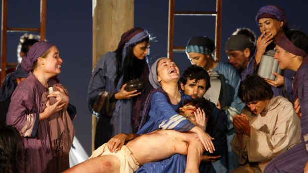 Darkness over the land: Around  Sydney yesterday,  actors played out the story of Christ's last hours on earth for the pilgrims gathered for World Youth Day festival. Scenes  included the  Last Supper  (below), his crucifixion and removal from the cross.