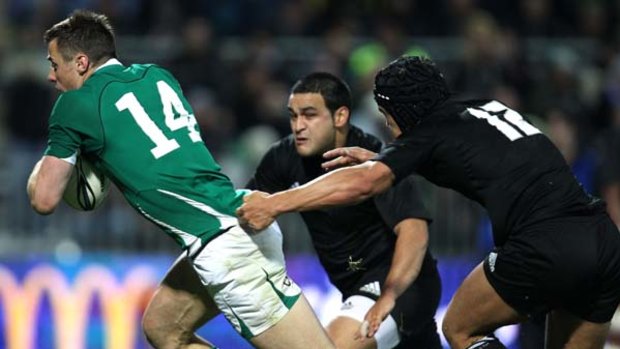 Irish flyer ... Tommy Bowe surges through the All Blacks' defence last week.
