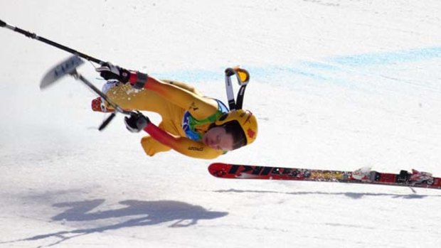 Andrea Dziewior of Canada crashes at the finish line during the women's alpine downhill.