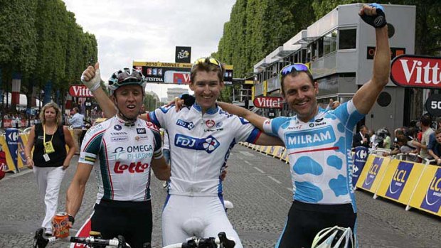 Wes Sulzberger (centre) celebrates finishing the Tour de France last year with fellow Aussies Matt LLoyd (left) and Luke Roberts.