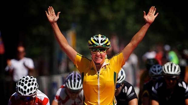 Road to success ... Rochelle Gilmore takes gold in the women's road race in Delhi yesterday. Fellow Australian Chloe Hosking picked up bronze.