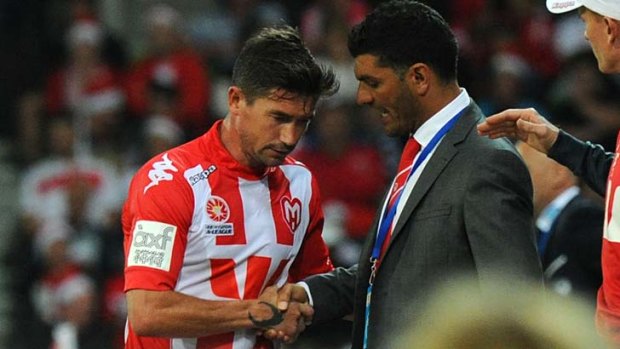 Melbourne Heart's Harry Kewell and coach John Aloisi after the team's loss in the Melbourne Derby.