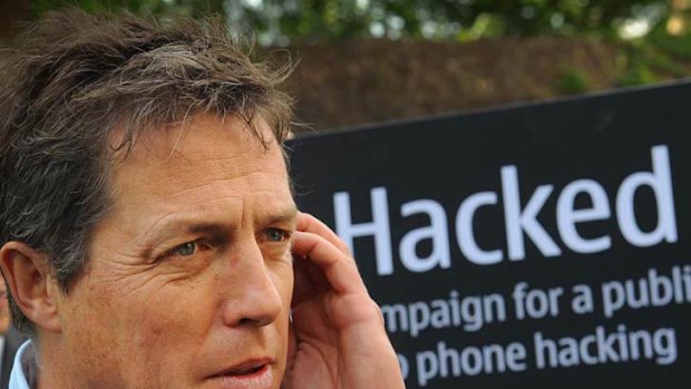 British actor Hugh Grant outside the Houses of Parliament in London, where a debate was being held into the allegations of phone hacking by journalists.