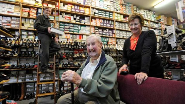 Eric Hicks (centre) with his children Murray and Julie in the store.