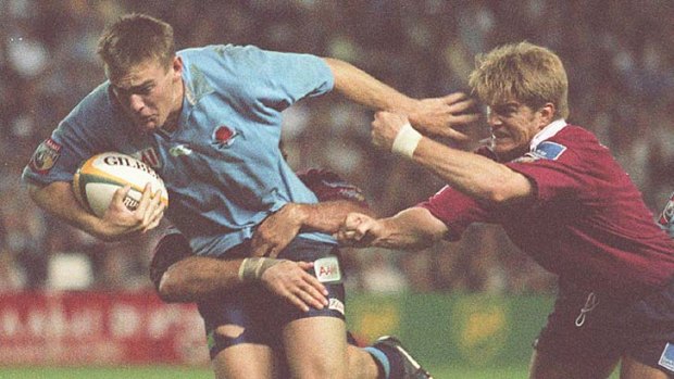 Fiery encounters &#8230; NSW and Queensland were at each other's throats during this heated clash at the SFS in 1997 where Chris Latham fends off Tim Horan.