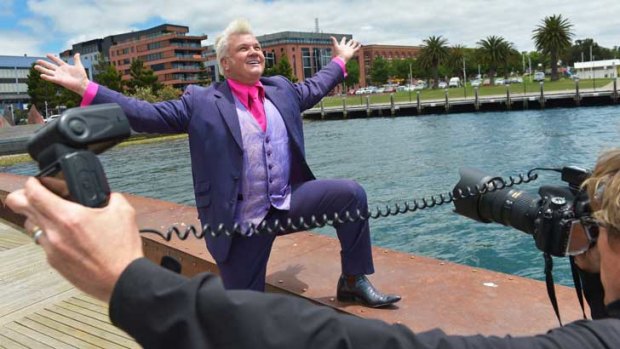 Darryn Lyons on the receiving end of paparazzi attention.