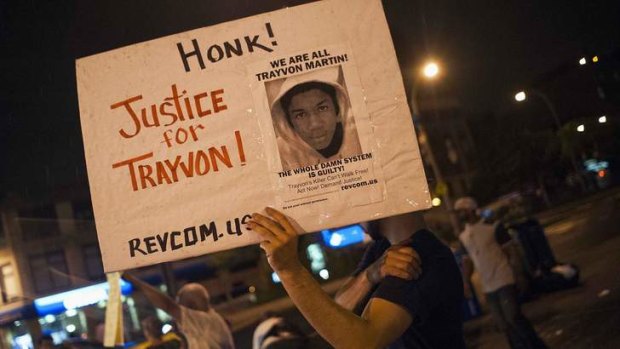Protestors rally in response to the acquittal of George Zimmerman in the Trayvon Martin trial, in the Harlem neighborhood of New York.