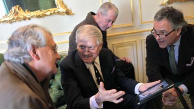 British artist David Hockney shows friends how he works on an iPad at the Pierre Berge foundation, in Paris.
