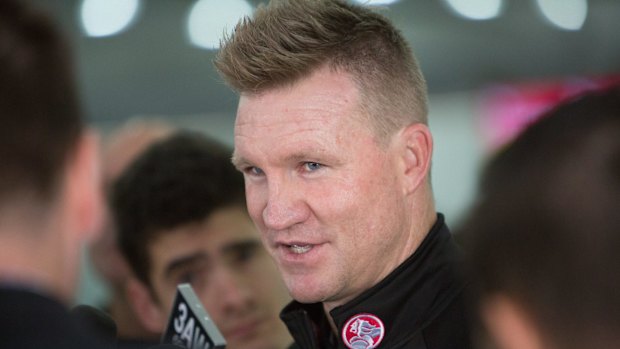 Pies coach Nathan Buckley with the Holden logo on his shirt.