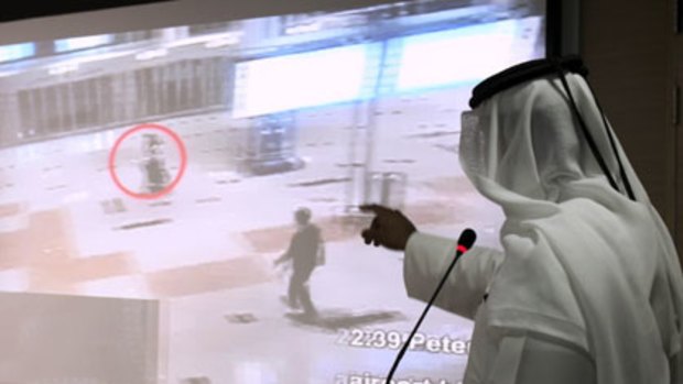 Video footage...a Dubai police official shows the suspects in Mabhouh's assassination.