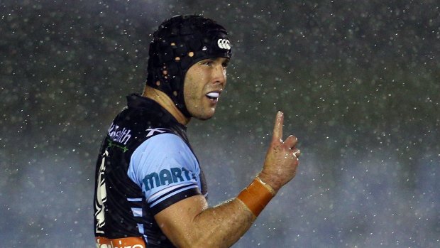 Tough customer: The rain pours down on Michael Ennis on Monday night.