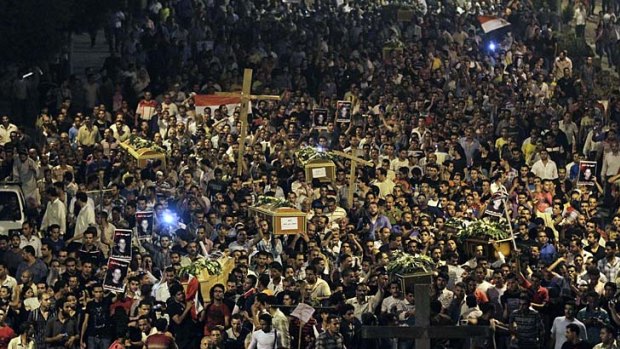 Grief and anger &#8230; Egyptian Copts carry the coffins of victims who were killed during clashes with military forces. Mourners called out: ''Oh, martyrs, sleep and rest, we will continue the struggle.''