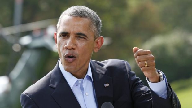 US President Barack Obama gestures as he speaks to the media on the situation in Iraq on the South Lawn of the White House.