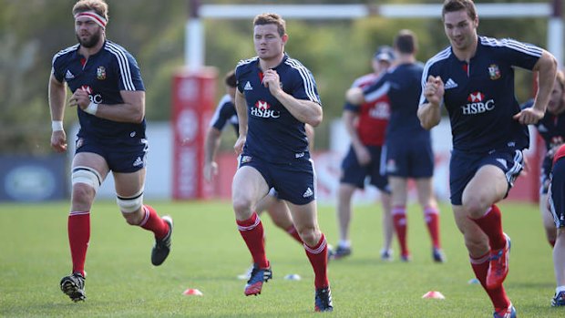 Gracious exit: Brian O’Driscoll (centre) trains with Geoff Parling (left) and George North.