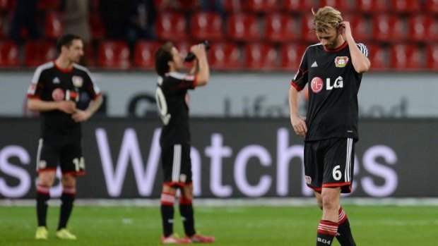 Simon Rolfes and Leverkusen players after the loss to Hoffenheim.