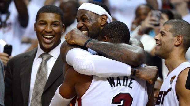 The Miami Heat's LeBron James and Dwyane Wade (No.3) celebrate their side's NBA championship win in game five of the finals series against the Oklahoma City Thunder.
