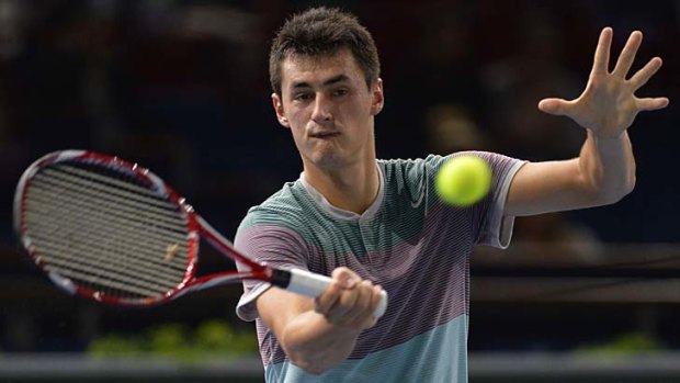 Bernard Tomic has accepted a wildcard to try to defend his title at the Sydney International from January 5.