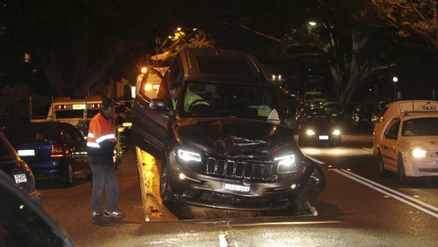 The crashed Jeep is removed from the scene after the crash.