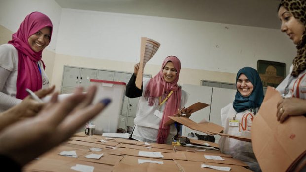 Election workers count votes in Benghazi, where the National Forces Alliance has triumphed.