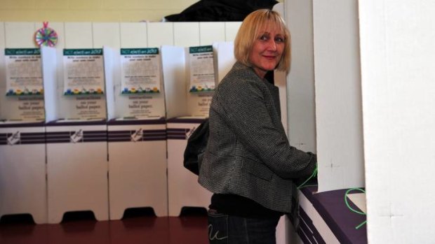 Leader of the ACT Greens Meredith Hunter casts her vote  at Aranda Primary school.