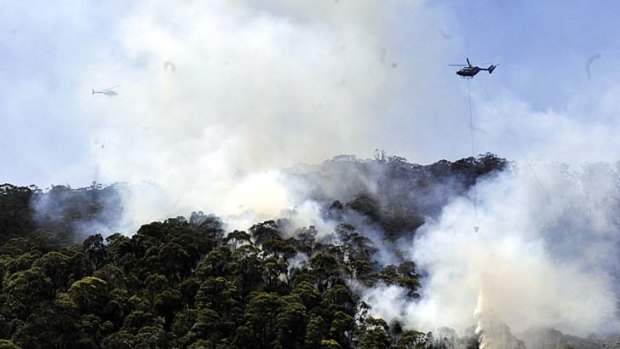 Lithgow ... helicopters water bomb a bushfire.