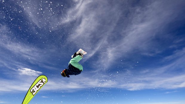 Extreme ... a snowboarder competes in the Dragon Big Air competition at Falls Creek.