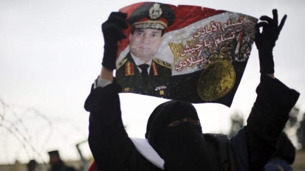 A supporter of Egypt's army chief Field Marshal Abdel Fattah al-Sisi  outside the trial.