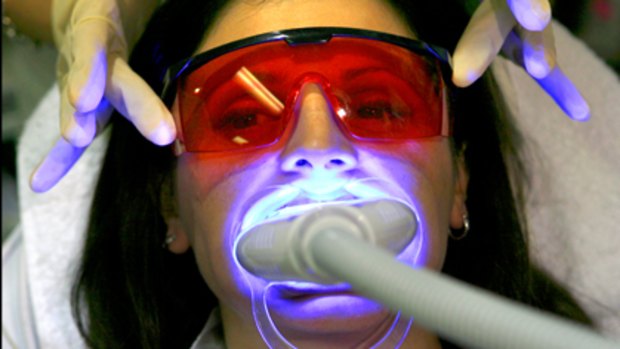 Dental blues ... a woman undergoes teeth whitening.