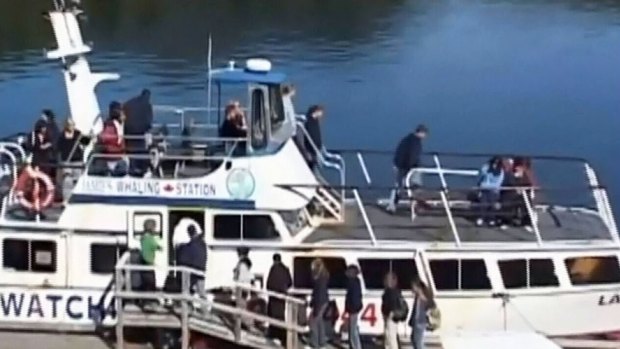Tourists board a whale-watching boat at Jamie's Whaling Station.