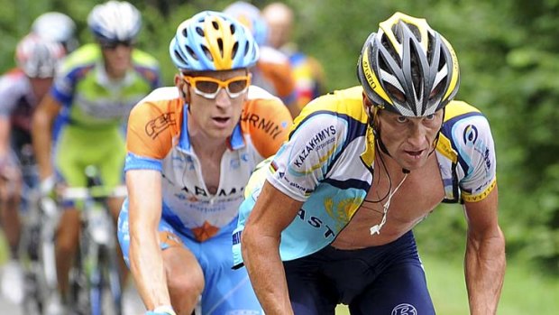 Lance Armstrong (right) climbs with Bradley Wiggins and during stage 17 of the 2009 Tour de France from Bourg-Saint-Maurice to Le Grand-Bornand.