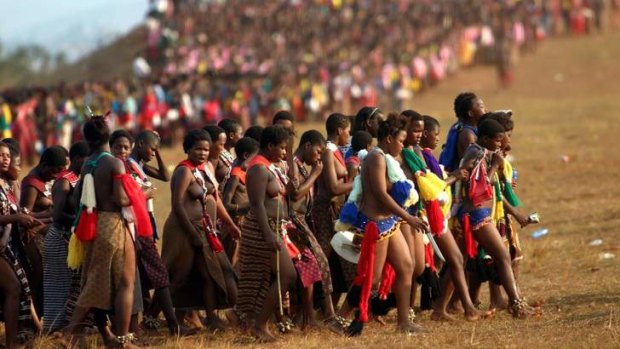 Pick me: Thousands of young girls gathered at the annual reed dance in Ludzidzini, Swaziland, in 2005. The annual ritual gives King Mswati  III an opportunity to choose another wife. His latest choice is  an 18-year-old beauty contestant.