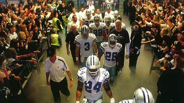 The Dallas Cowboys make their way through field-boxes - a look Sports Minister Terry Waldron would like to see replicated at Perth's new Burswood stadium.