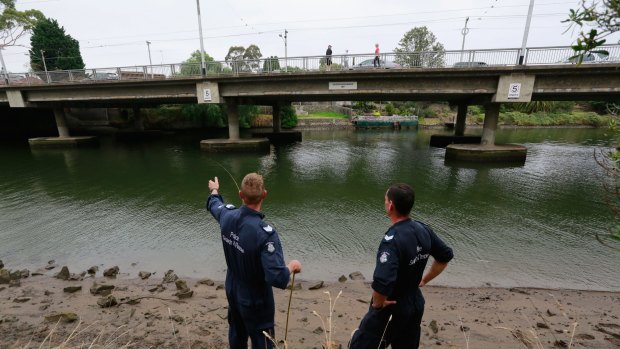 Police divers search for body parts.