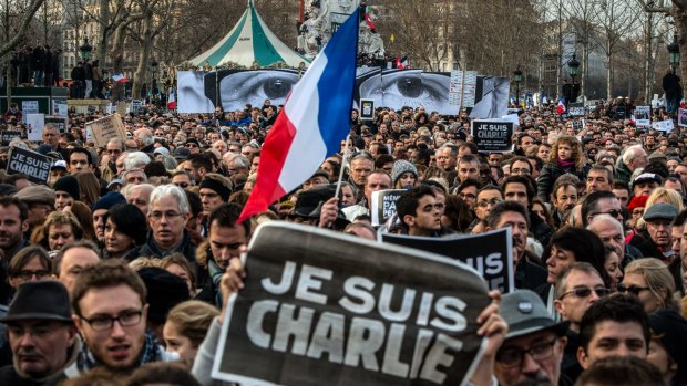 Thousands gather in Paris for a solidarity march with victims of the Charlie Hebdo massacre. The attack has sparked new calls to bolster the right to free speech in Australia. 