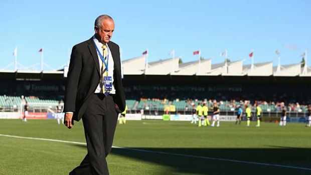 Mariners coach Graham Arnold walks from the ground after he was sent off during the round 16 match against Melbourne Victory on January 12.