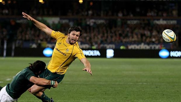Out of reach . . .  Adam Ashley-Cooper of the Wallabies is denied a try by the tackle of Francois Hougaard as he drops the ball just short of the line.